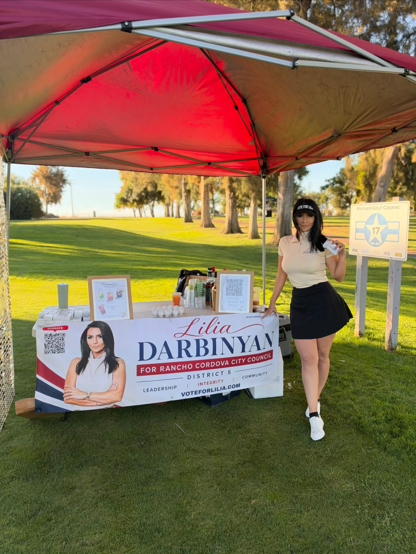 Lilia at her campaign booth at a local golf course