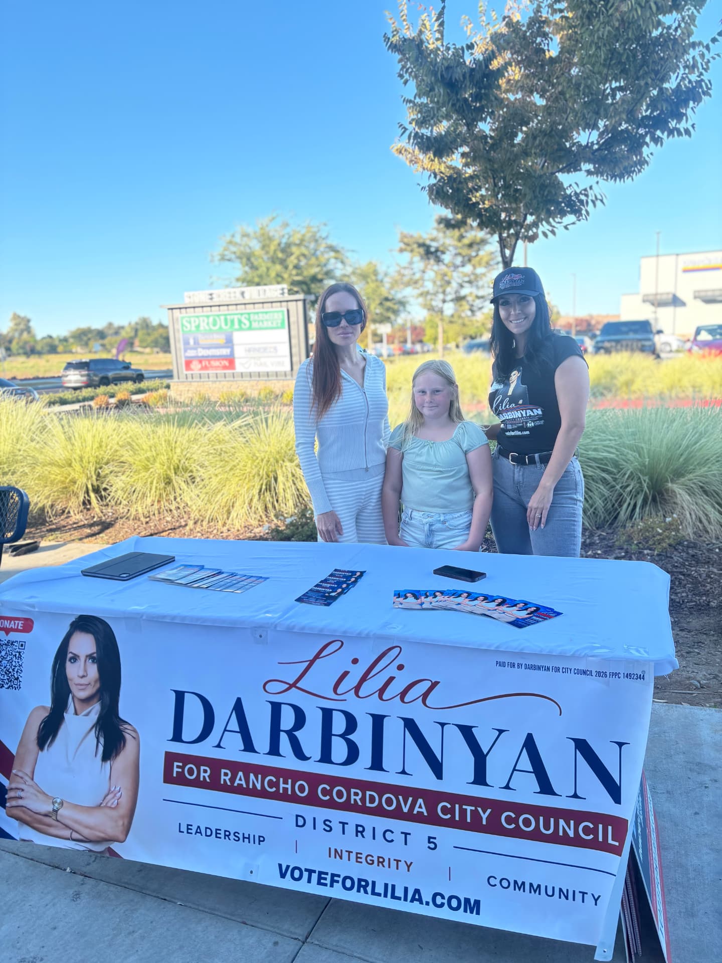Lilia with supporters at a neighborhood campaign table