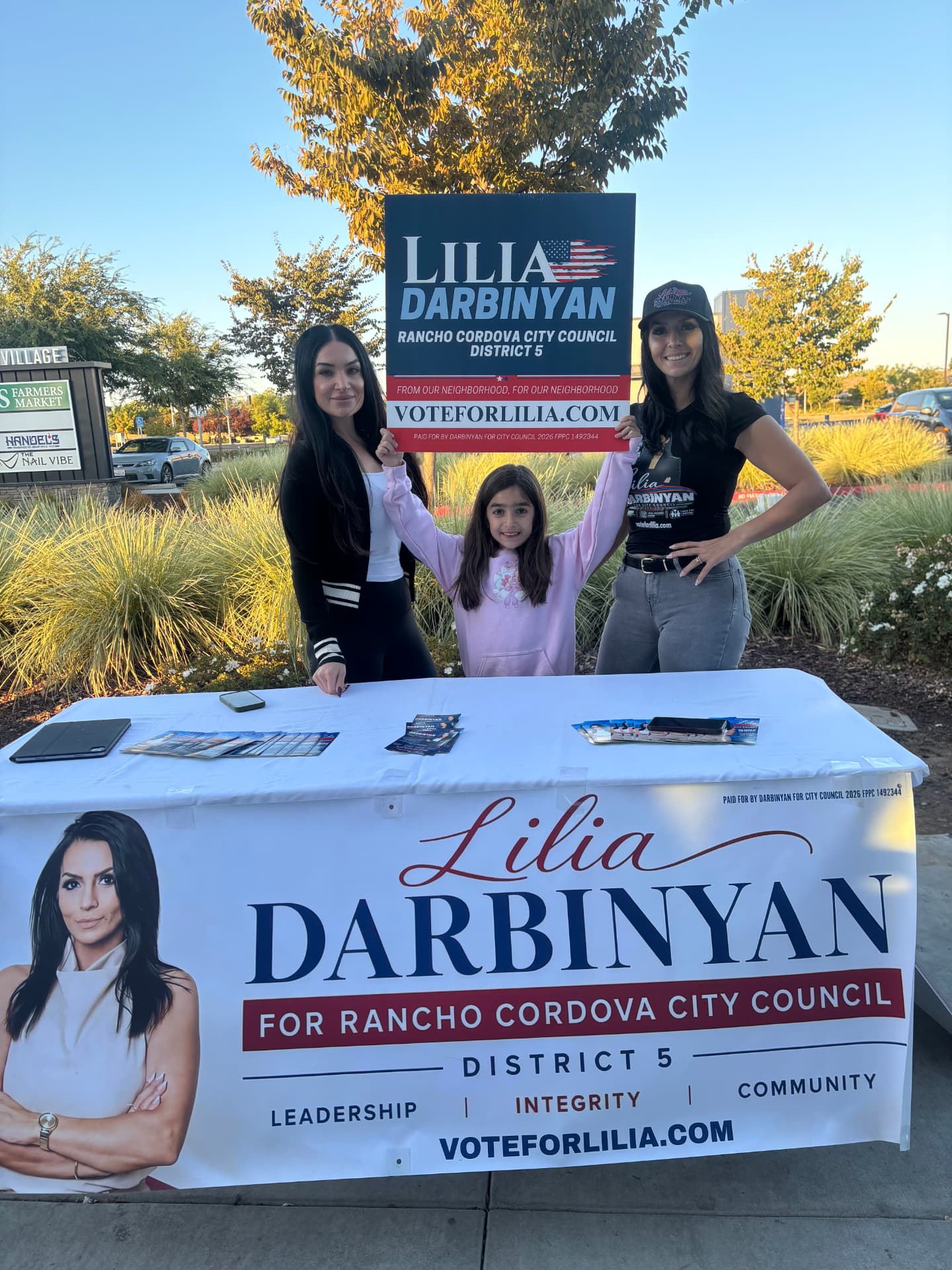 Lilia with volunteers at a community booth in Rancho Cordova